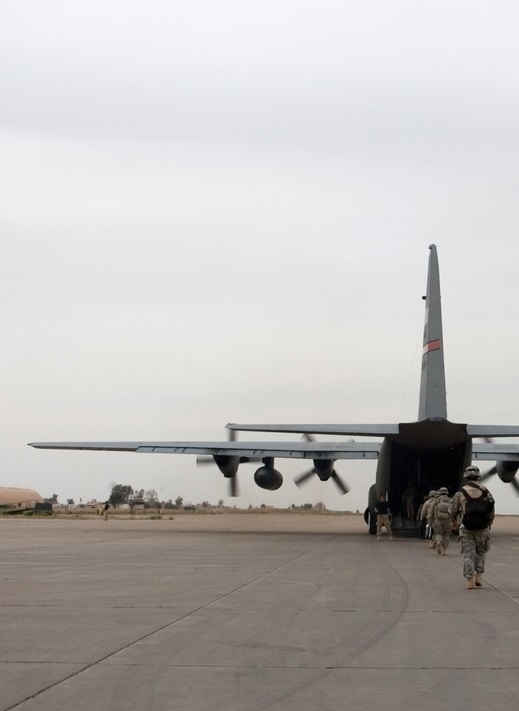 A soldier loads up onto an American plane near Mosul, Iraq.